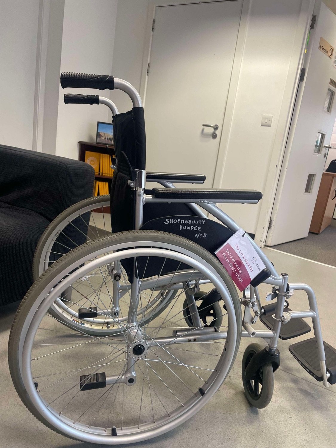 A manual wheelchair that can be self-propelled or pushed from behind