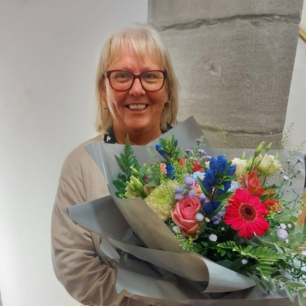 Mary Sneddon from The Board steps down and has been given a beautiful bunch of flowers.
