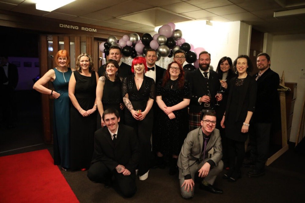 A group photo of The Circle team at a celebration event for the Institute of Director Awards in 2021