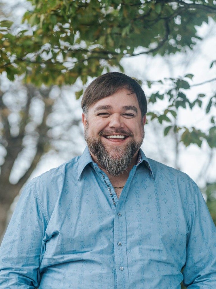 Headshot of Campbell Archibald, chair of The Circle Board smiling