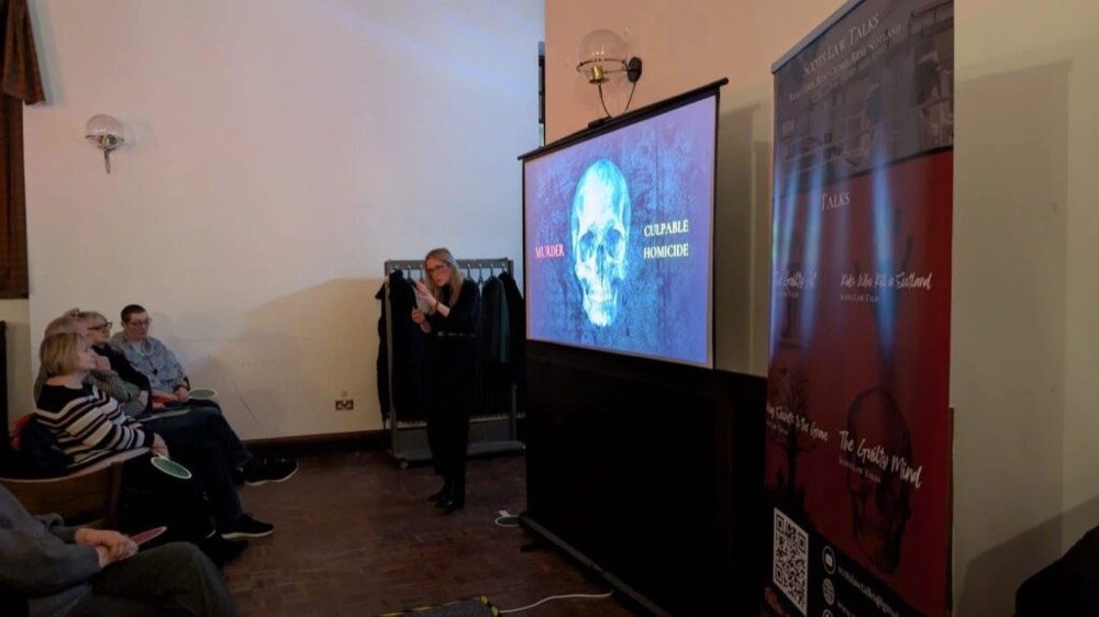 A photo of Lindsay from Scots Law Talks delivering a presentation